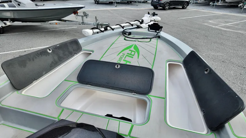 Slide: The Image of 2025 ALK2 Powerboats 21 BHX deck with storage compartments and trolling motor. - 16