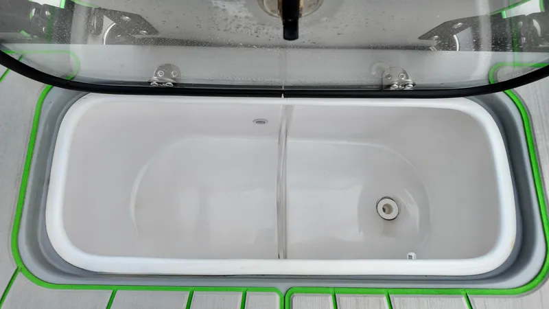 Slide: The Image of Livewell compartment in 2025 ALK2 Powerboats 21 BHX, featuring a sleek design and drainage system. - 19