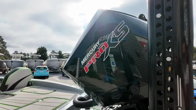 Slide: The Image of 2025 ALK2 Powerboats 21 BHX with Mercury Pro XS engine in a marina setting. - 4