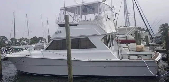 The Image of 1982 Viking 46 Convertible yacht docked at a marina. - 0