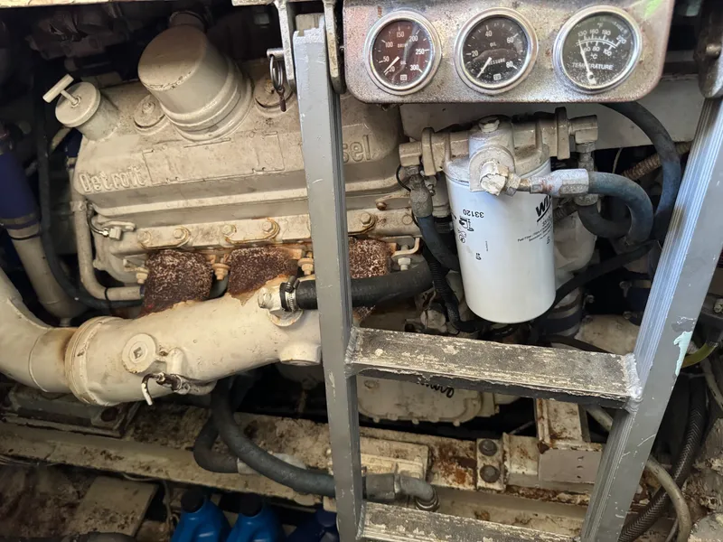 Slide: The Image of Engine compartment of a 1982 Viking 46 Convertible boat, showing gauges and components. - 20