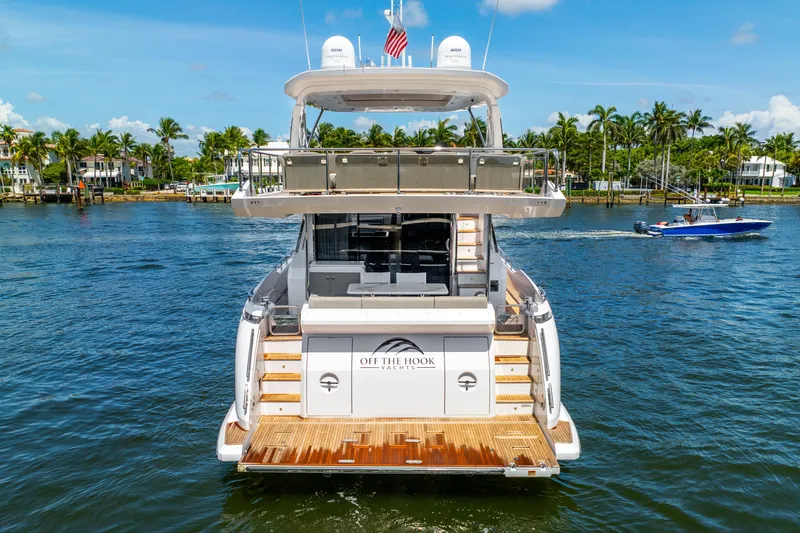 Slide: The Image of Azimut Fly 72 yacht, 2021 model, cruising on a sunny day with palm trees in the background. - 11