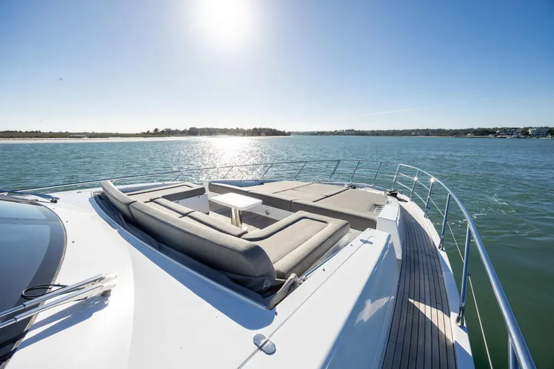 Slide: The Image of Azimut Fly 72 yacht deck with sun loungers, 2021 model, cruising on a sunny day. - 16