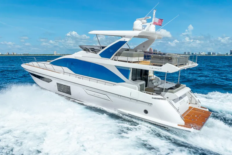 Slide: The Image of Azimut Fly 72 yacht cruising on the ocean, 2021 model, with clear blue skies. - 2