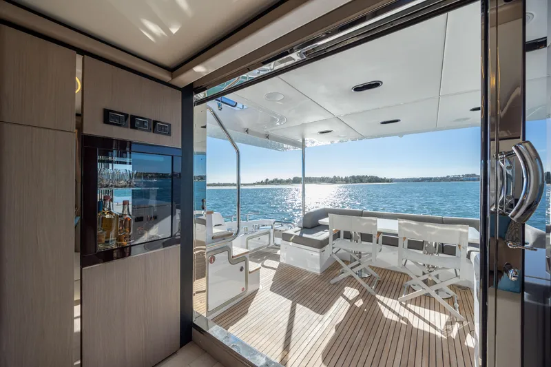 Slide: The Image of Luxurious 2021 Azimut Fly 72 yacht interior with ocean view and elegant seating area. - 20