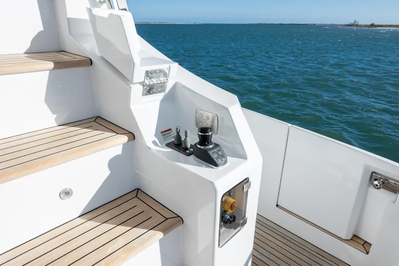 Slide: The Image of Azimut Fly 72 yacht controls and stairs with ocean view, 2021 model. - 25