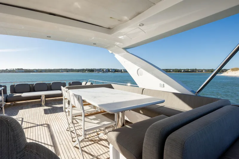 Slide: The Image of Luxurious 2021 Azimut Fly 72 yacht deck with elegant seating and ocean view. - 29