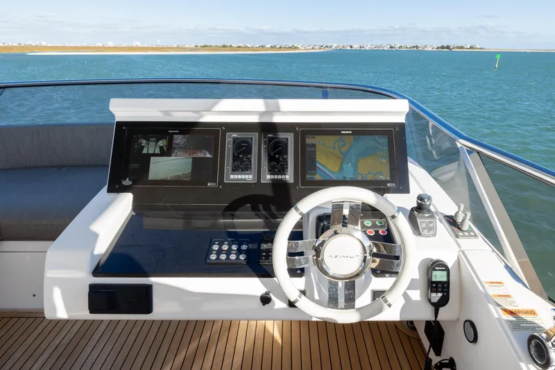 Slide: The Image of Cockpit of 2021 Azimut Fly 72 yacht with modern navigation controls. - 34