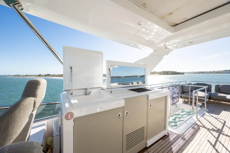 Slide: The Image of Luxurious 2021 Azimut Fly 72 yacht deck with outdoor kitchen and ocean view. - 37
