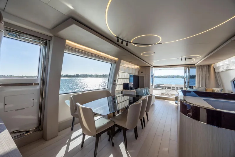 Slide: The Image of Luxurious interior of 2021 Azimut Fly 72 yacht with elegant dining area and scenic ocean view. - 43
