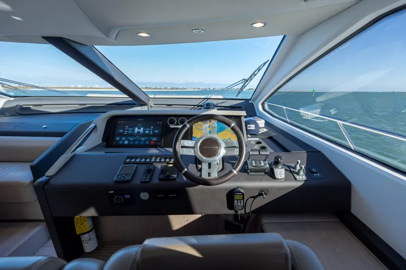 Slide: The Image of Helm of 2021 Azimut Fly 72 yacht with modern controls and ocean view. - 50