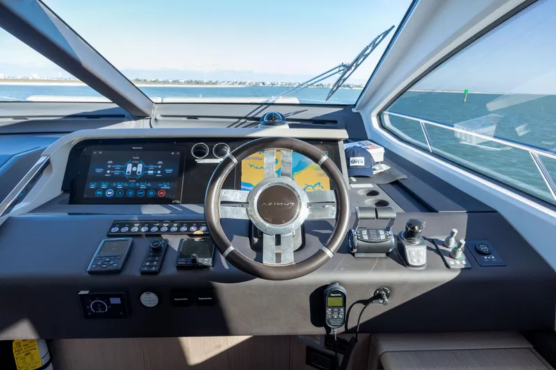 Slide: The Image of Cockpit of 2021 Azimut Fly 72 yacht with modern navigation controls and sea view. - 52