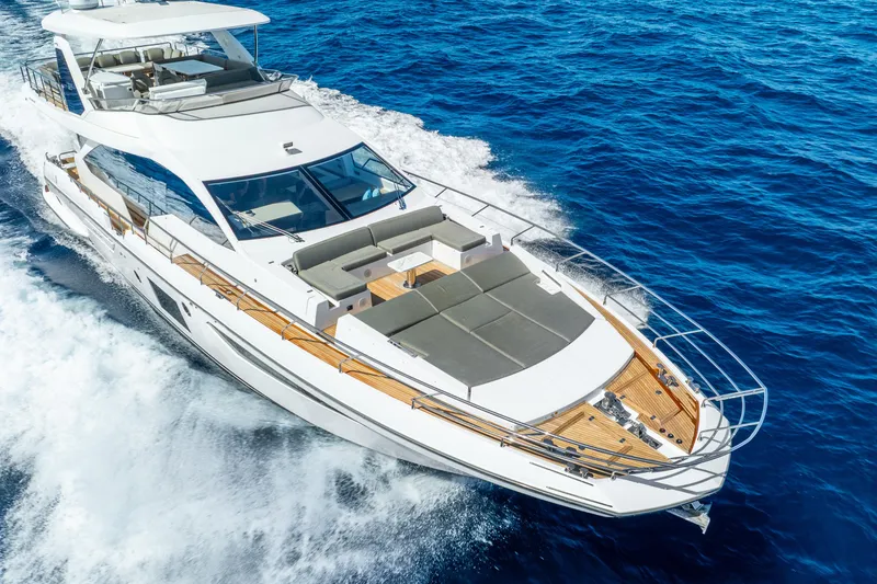 Slide: The Image of Luxurious 2021 Azimut Fly 72 yacht cruising on vibrant blue ocean waters. - 6
