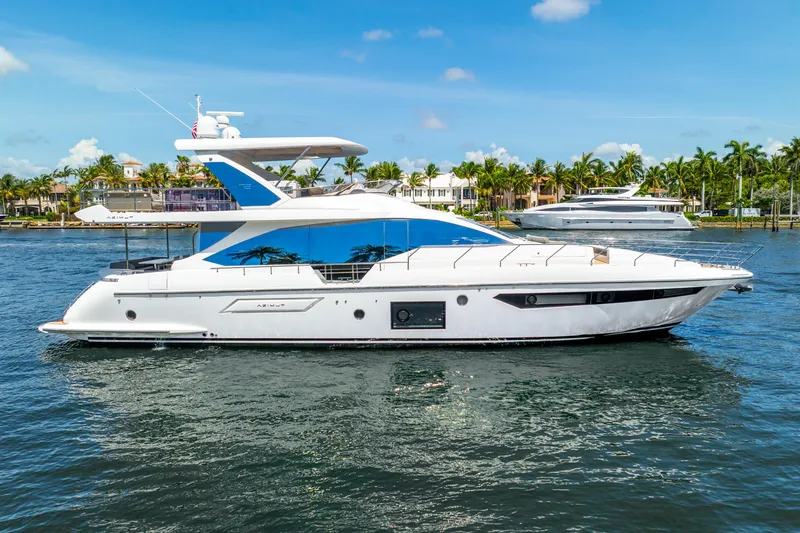 Slide: The Image of 2021 Azimut Fly 72 yacht on a sunny day, cruising near palm-lined shore. - 8