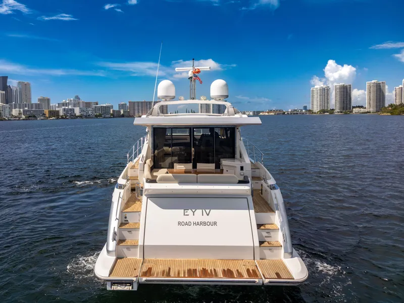 Slide: The Image of 2016 Azimut 55S yacht cruising near city skyline under clear blue sky. - 18