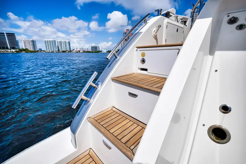 Slide: The Image of Staircase on 2016 Azimut 55S yacht with wooden steps, overlooking a scenic waterfront. - 21