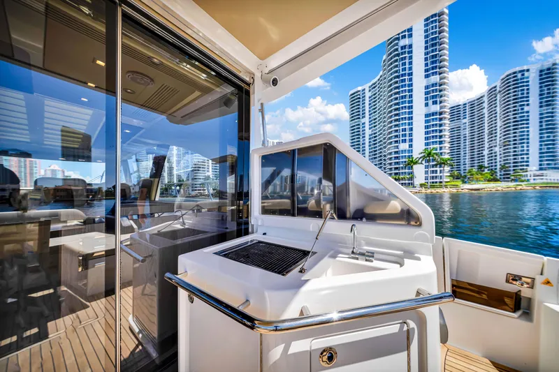 Slide: The Image of Luxurious 2016 Azimut 55S yacht deck with modern cityscape view. - 23