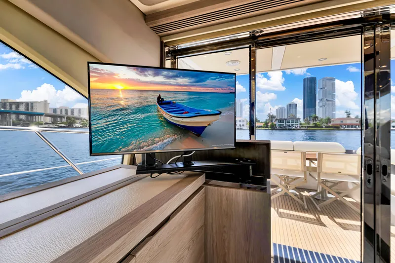 Slide: The Image of Luxurious interior of 2016 Azimut 55S yacht with TV and scenic waterfront view. - 29