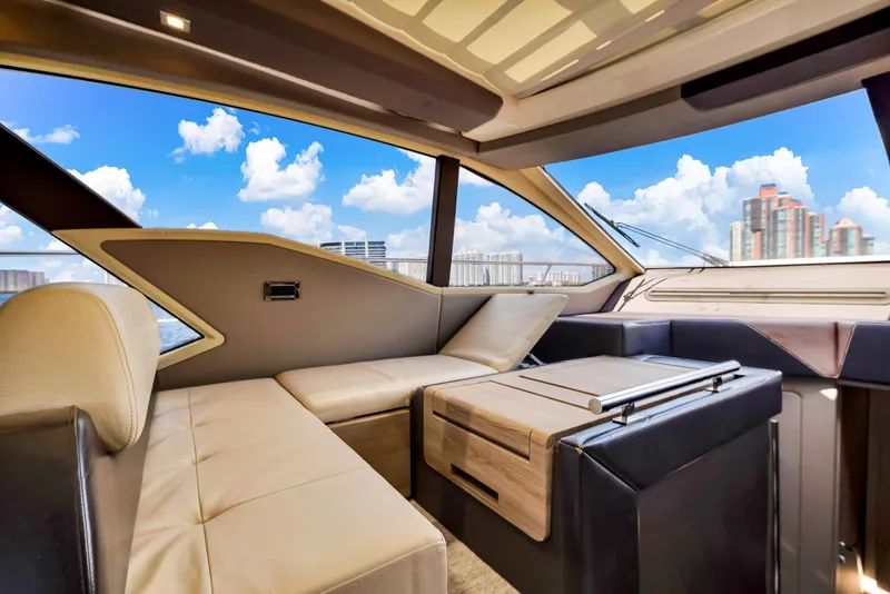 Slide: The Image of Luxurious interior of 2016 Azimut 55S yacht with modern seating and city skyline view. - 36