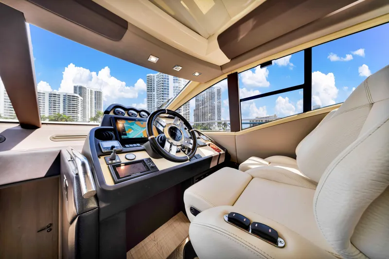 Slide: The Image of Luxurious 2016 Azimut 55S yacht cockpit with modern controls and plush seating. - 38