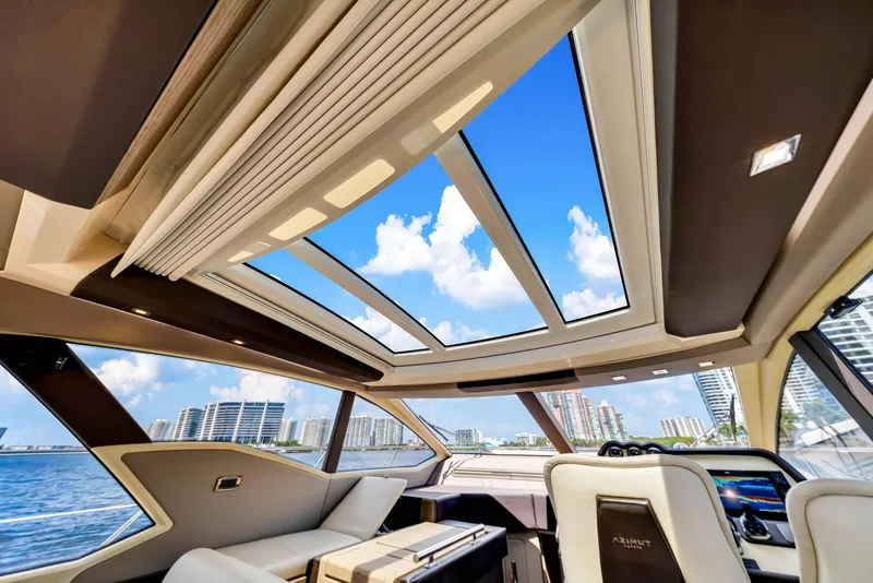 Slide: The Image of Luxurious interior of 2016 Azimut 55S yacht with panoramic sunroof and waterfront view. - 41