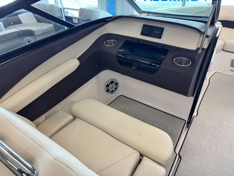 Slide: The Image of Luxurious interior of 2025 Regal LS2 boat with beige seating and modern amenities. - 11