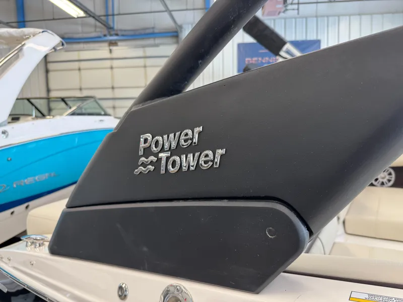 Slide: The Image of 2025 Regal LS2 boat with Power Tower feature in a showroom. - 19