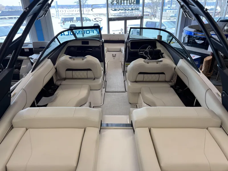 Slide: The Image of 2025 Regal LS2 boat interior with luxurious beige seating and modern design. - 3