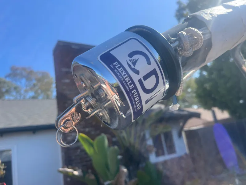 Slide: The Image of CDI flexible furler on a Malbec 18 sailboat, 2023 model, with a sunny background. - 2