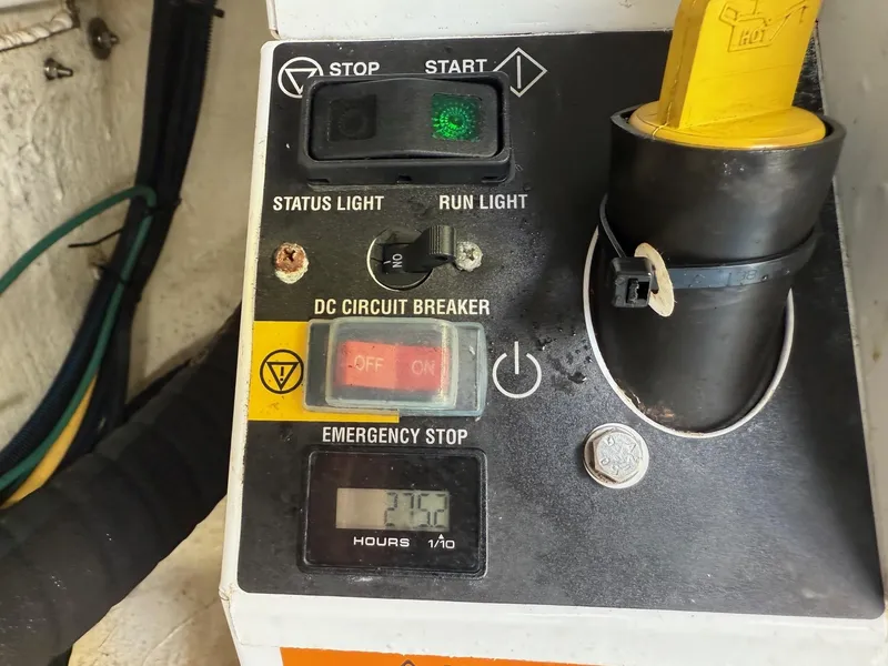 Slide: The Image of Control panel of a 2019 Back Cove Downeast boat with status lights and emergency stop. - 49