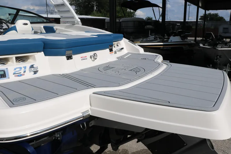 Slide: The Image of 2025 Chaparral 21 Surf boat with spacious swim platform and sleek design. - 12