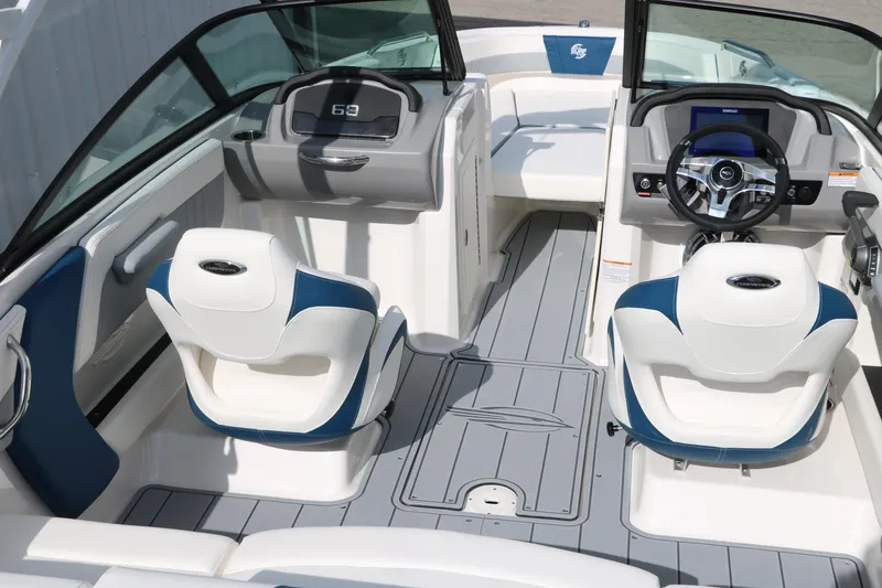 Slide: The Image of 2025 Chaparral 21 Surf boat interior with modern seating and dashboard design. - 13