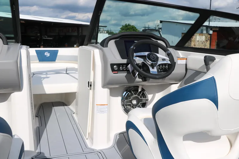 Slide: The Image of 2025 Chaparral 21 Surf boat interior with modern dashboard and seating. - 20
