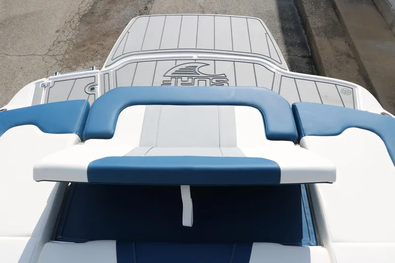 Slide: The Image of 2025 Chaparral 21 Surf boat with stylish blue and white seating. - 24