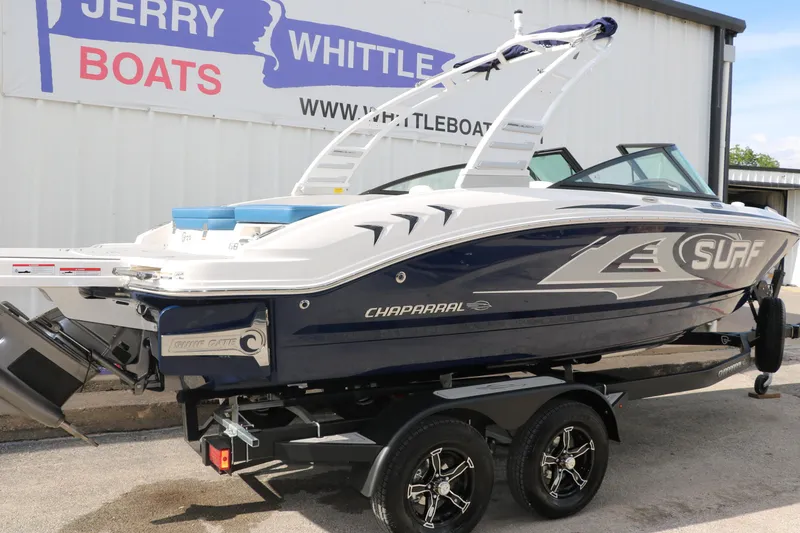 Slide: The Image of 2025 Chaparral 21 Surf boat on trailer at dealership. - 3