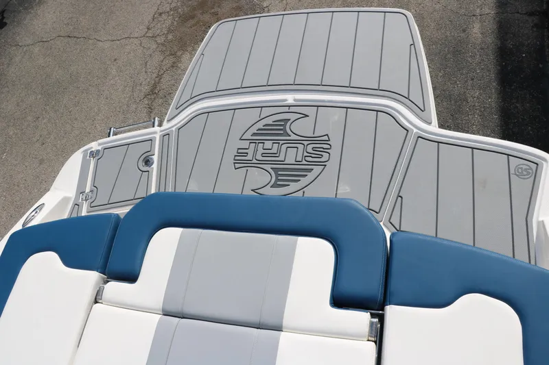 Slide: The Image of 2025 Chaparral 21 Surf boat deck with blue and gray seating. - 30