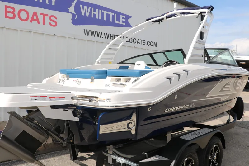 Slide: The Image of 2025 Chaparral 21 Surf boat on trailer at Whittle Boats dealership. - 4