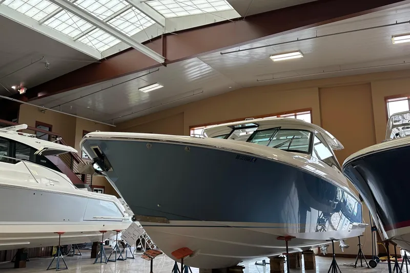 Slide: The Image of 2022 Tiara Yachts 38 LX in showroom, showcasing sleek design and modern features. - 11