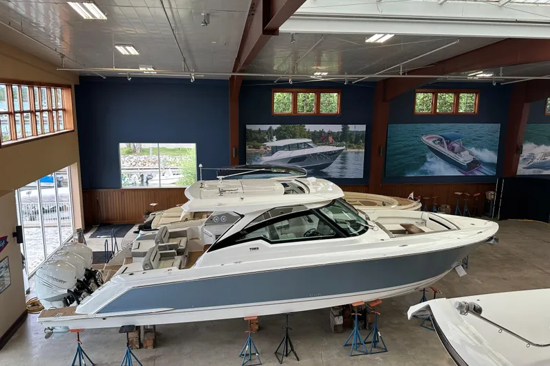 Slide: The Image of 2022 Tiara Yachts 38 LX displayed indoors, showcasing sleek design and luxury features. - 13