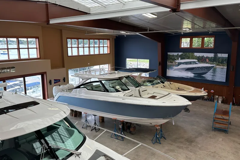 Slide: The Image of 2022 Tiara Yachts 38 LX displayed in a showroom with large windows. - 14