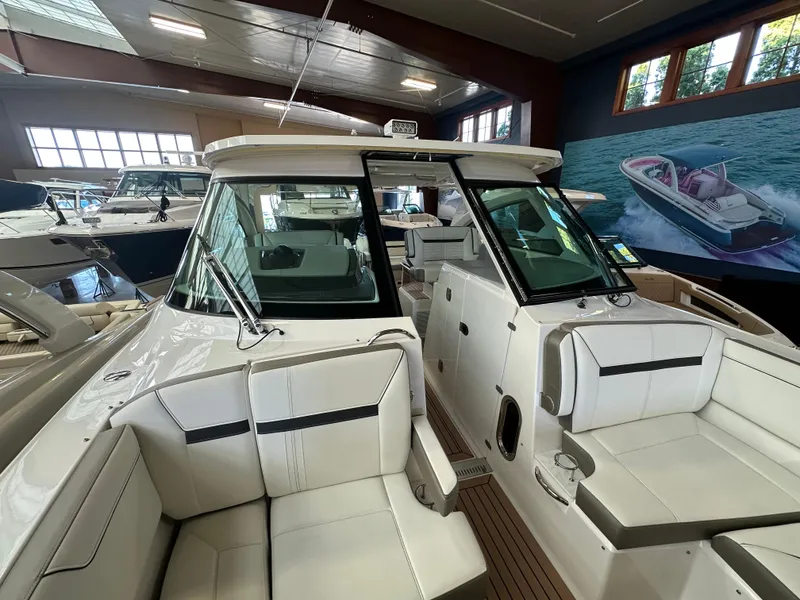 Slide: The Image of 2022 Tiara Yachts 38 LX luxury boat interior in showroom setting. - 21