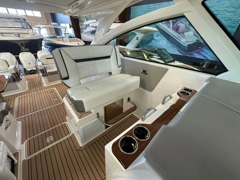 Slide: The Image of 2022 Tiara Yachts 38 LX interior with luxurious seating and sleek design. - 22