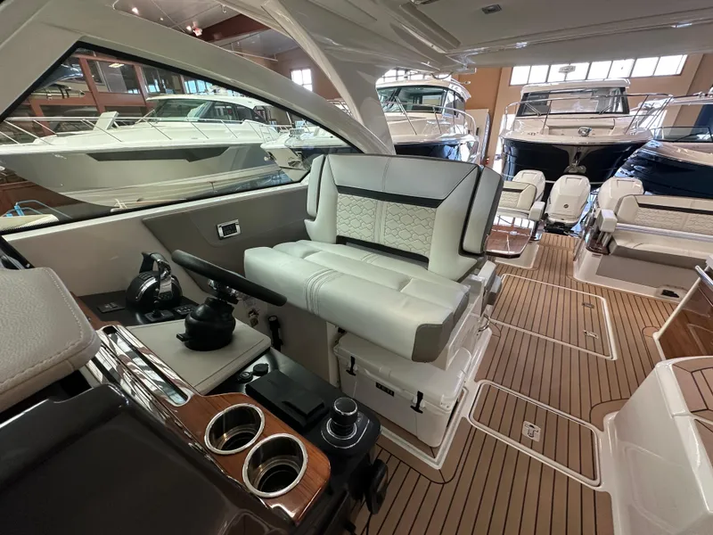 Slide: The Image of 2022 Tiara Yachts 38 LX interior showcasing luxurious seating and modern helm controls. - 23