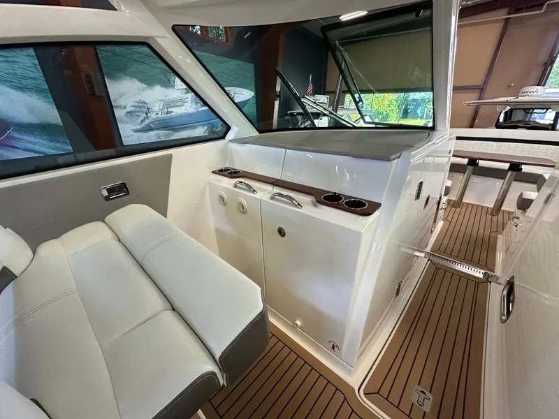 Slide: The Image of 2022 Tiara Yachts 38 LX interior with sleek seating and modern design elements. - 25