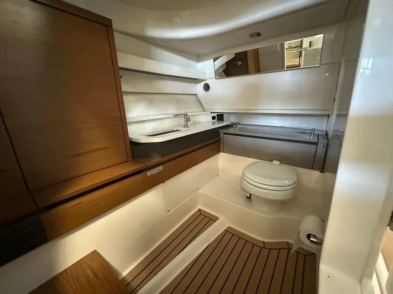 Slide: The Image of Luxurious bathroom in 2022 Tiara Yachts 38 LX, featuring modern fixtures and wood accents. - 27