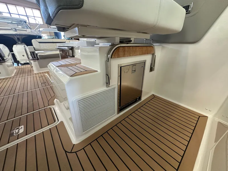 Slide: The Image of 2022 Tiara Yachts 38 LX interior with sleek seating and modern flooring. - 28