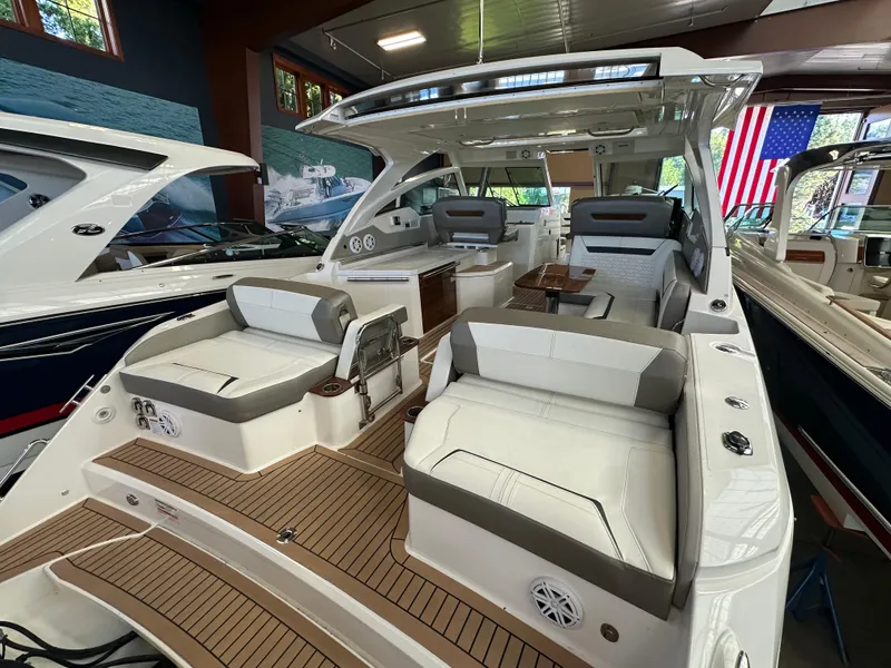 Slide: The Image of 2022 Tiara Yachts 38 LX luxury boat interior with seating and wooden flooring. - 35