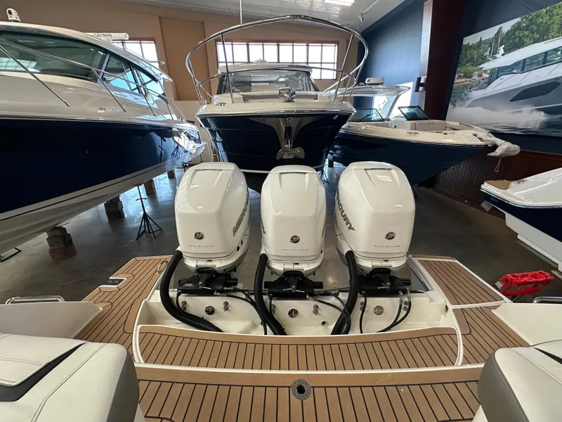 Slide: The Image of 2022 Tiara Yachts 38 LX with triple Mercury outboard engines in showroom. - 36