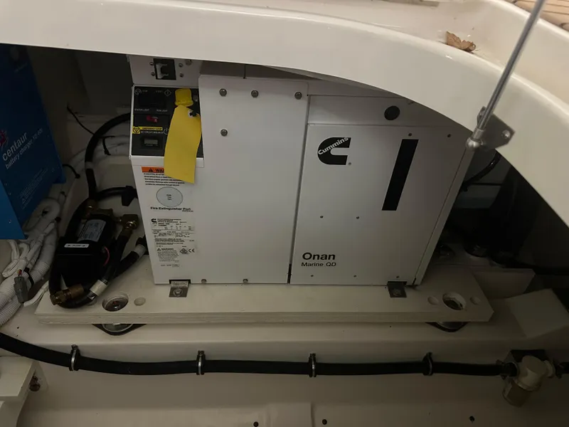 Slide: The Image of Engine compartment of 2022 Tiara Yachts 38 LX with Onan generator. - 38