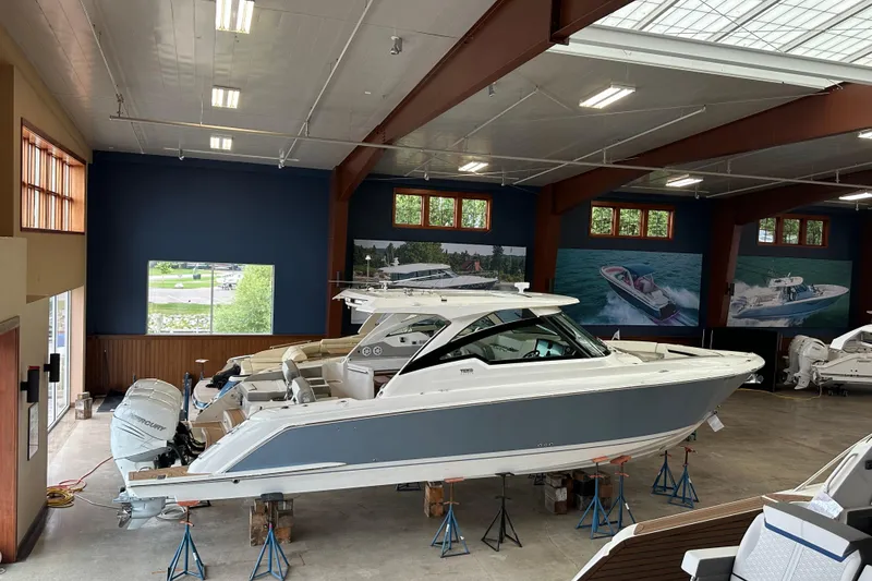 Slide: The Image of 2022 Tiara Yachts 38 LX displayed in a showroom, showcasing sleek design and luxury features. - 8